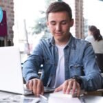 young student with laptop studying for the ielts test with englishprep